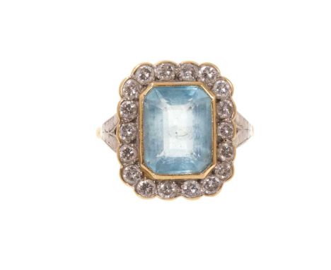 Aquamarine and diamond ring with a rectangular step cut aquamarine, measuring approximately 10.8mm x 8.4mm x 5.3mm, surrounde