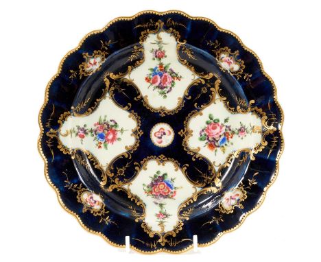 Worcester Burdett-Coutts Service blue ground plate, circa 1770, fluted edge, painted with flowers and butterflies in scroll p