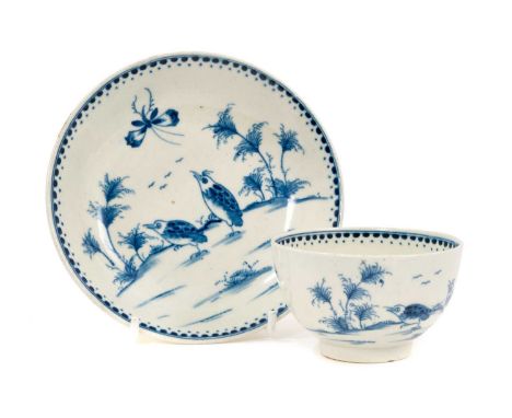 A rare Worcester tea bowl and saucer, circa 1770, painted in the Japanese style with the Two Quail pattern, dotted borders, c