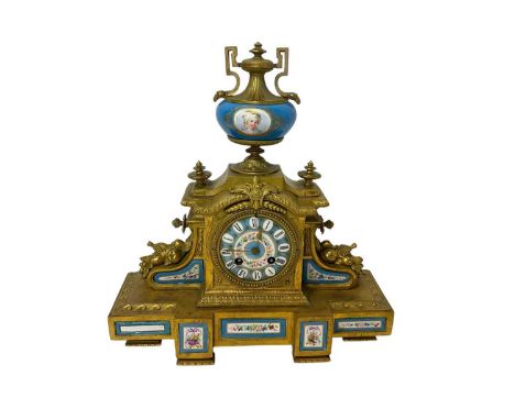 19th century French porcelain mounted gilt metal mantel clock with painted panels, urn surmount, French movement striking on 