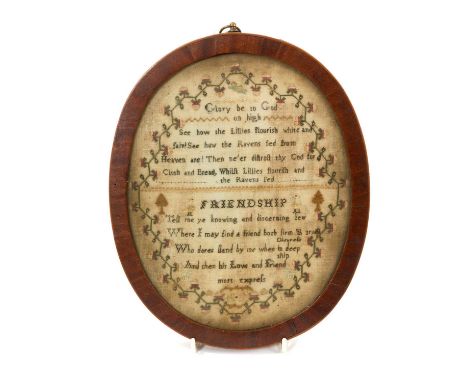 George III oval framed sampler titled ‘Friendship’, with didactic verse and foliate border in glazed mahogany frame, 26 x 20c