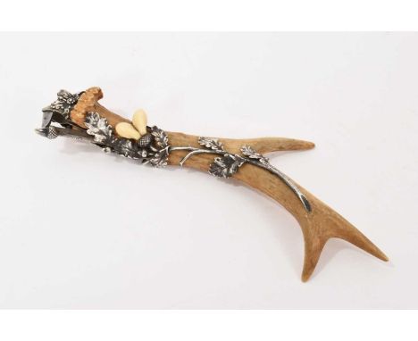 Rare Austrian cigar cutter by Georg Adam Scheid (1866-1922) mounted on antler, in silver with elaborate oak leaf detail, with