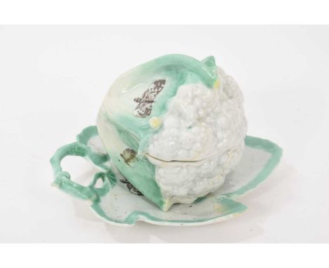A rare Worcester cauliflower shaped tureen, cover and stand, circa 1756-58, decorated in green enamel and printed with butter