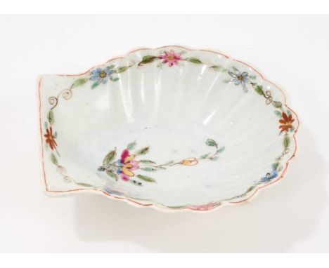 An early Worcester pickle dish, circa 1753-54, formed as a scallop shell, painted in polychrome enamels with a central flower