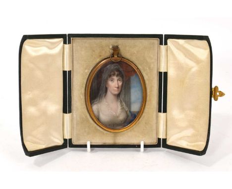 English School, circa 1800, portrait miniature of a lady in white dress and shawl, unsigned, oval 8 x 6cm, in glazed gilt fra