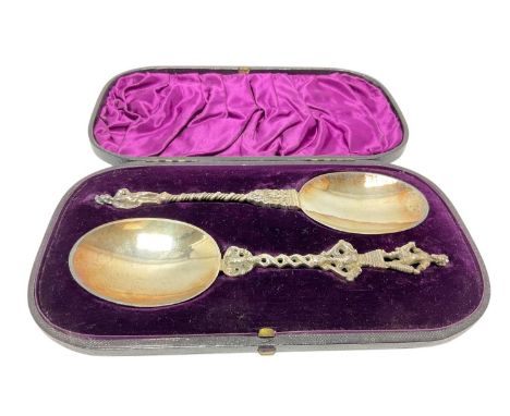 Pair Victorian silver gilt spoons, with Aztec style figurative terminals and twisted stems, in the Dutch style, in a fitted c