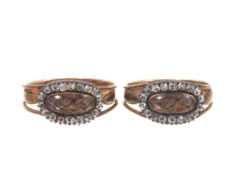 A very rare pair of George III gold and diamond mourning rings, each with a glazed compartment of plaited hair surrounded by 