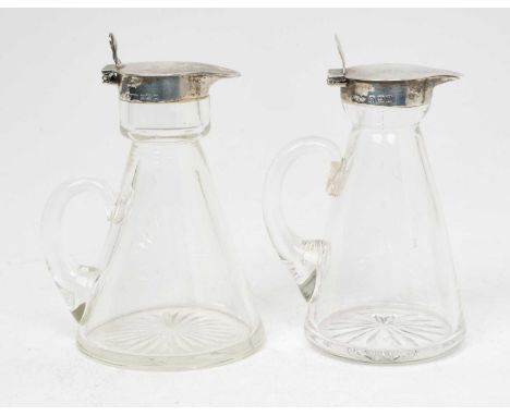 An early 20th century silver mounted glass whiskey tot/chota peg, of conical form, with star cut base and hinged silver cover