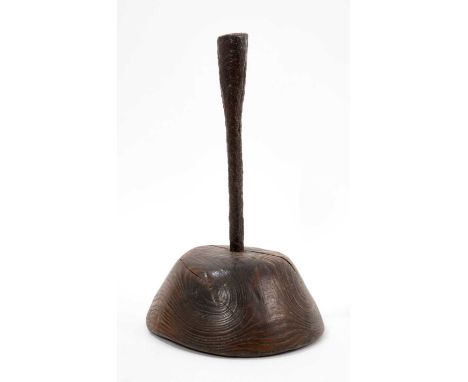 Good 18th century wrought iron and elm candlestick, raised on domed base, 24cm high. Provenance: previously offered Bonhams, 