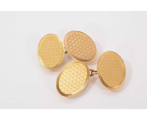 Pair of 1930s 18ct gold oval panel cufflinks with engine turned decoration (Chester 1930)Weight 9 grams in total. Good condit