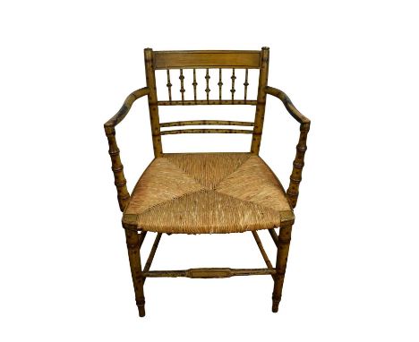 Regency faux bamboo open armchair, with bobbin back and caned seat  Good solid condition, new side panel to the seat, some ge