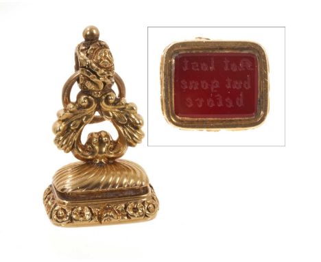 Unusual George III gold mourning seal, the concealed compartment revealing a double lock of plaited hair and inscription 'J.S
