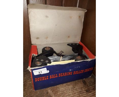 A pair of Davies double ball bearing roller skates, in box 