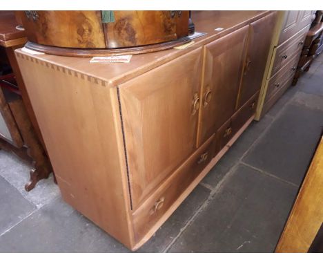 An Ercol blonde sideboard 