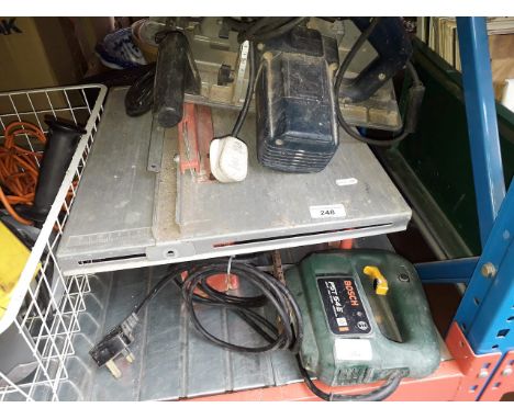 A power Neville tile cutter, A Bosch GKS 65 circular saw and a Bosch jigsaw 