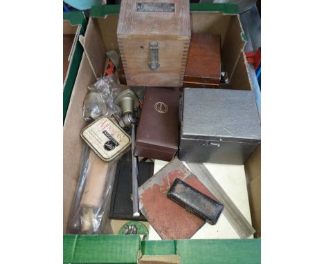 A cased research magnifier, a volt meter, a revolutions measuring device, and an assortment of misc boxed tools 