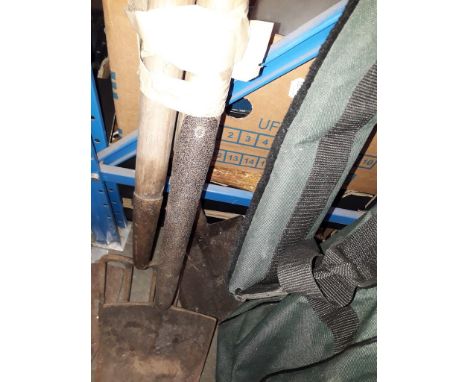 A garden fork and 2 spades 