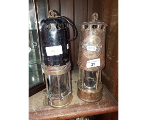 Two old miners lamps including 'The Protector Lamp &amp; Lighting Co.', 