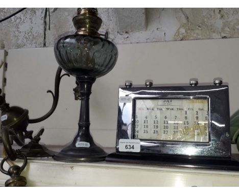 A french oil lamp, a brass light fitting and a 1920's perpetual calender 
