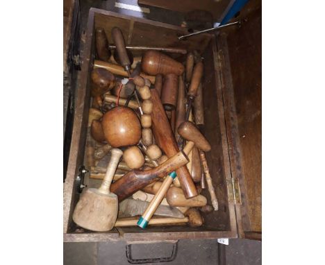 A wooden toolbox containing lead working tools including mallets etc 