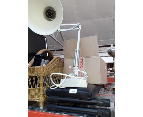 An angle poise lamp, a keyboard stool and some stainless steel pans 