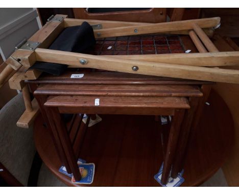 A tile topped nest of tables and a directors chair 