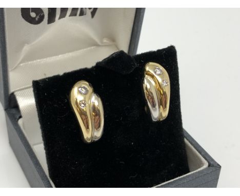 A pair of 18ct yellow and white gold diamond set earrings CONDITION REPORT: 7.4g