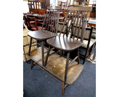 A pair of Ercol spindle back dining chairs together with a stained elm low coffee table 