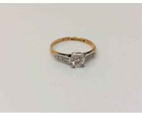 An antique 18ct gold diamond solitaire ring with diamond set shoulders, size F1/2 CONDITION REPORT: 1.6g