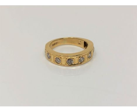 An 18ct gold diamond set half eternity ring, approx. 0.5 carat total weight, size I/J