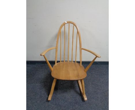 An Ercol elm and beech spindle backed rocking chair 