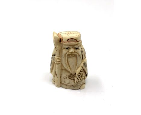 A carved Chinese bone netsuke -Elderly Gentleman with staff