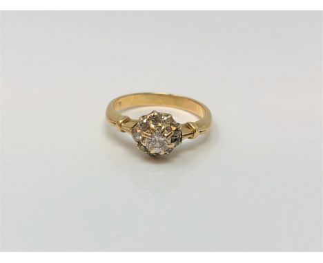 An 18ct gold diamond cluster ring, centre stone approx. 0.2 carat, size I CONDITION REPORT: 2.5g