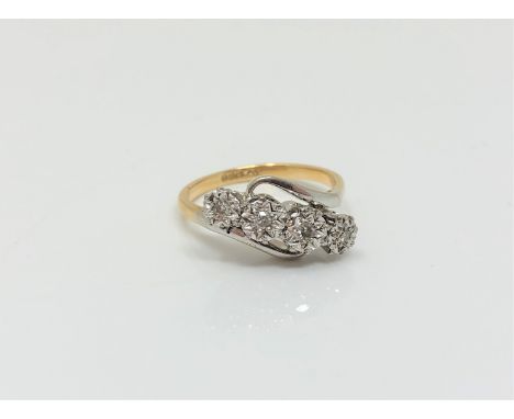 An 18ct gold and platinum four stone diamond ring, size M CONDITION REPORT: 4g