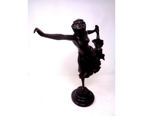 A bronze Art Deco style figure, dancing lady, after C L. J. R. Colinet on a circular marble base, height 41.5 cm  