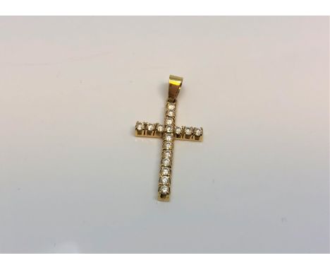 An 18ct yellow gold diamond cross pendant, the seventeen diamonds approximately 0.6ct.