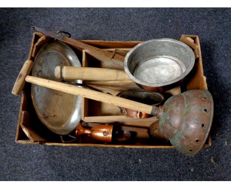 A box of antique copper cast iron handled pans, rolling pin, poss stick etc 