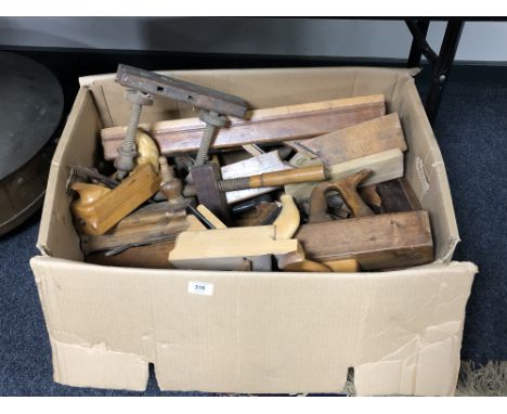 A box containing a very large quantity of woodworking planes and other carpentry tools 