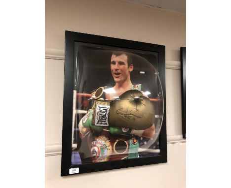 A sporting memorabilia montage : A signed gold Everlast boxing glove, Joe Calzaghe, with certificate of authenticity from Mon