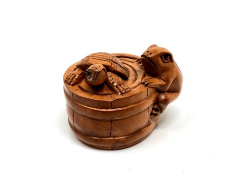 A carved Chinese hardwood netsuke - Turtle and frog in barrel