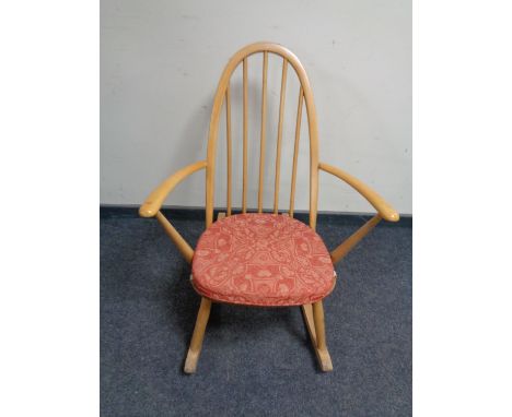 An Ercol elm and beech spindle backed rocking chair 