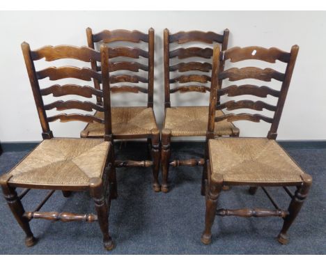 A set of four beech ladder back kitchen chairs with rattan seats 