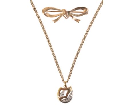 A MARQUISE DIAMOND PENDANT NECKLACE AND BOW BROOCHin 18ct yellow gold, set with a marquise diamond and round brilliant cut di