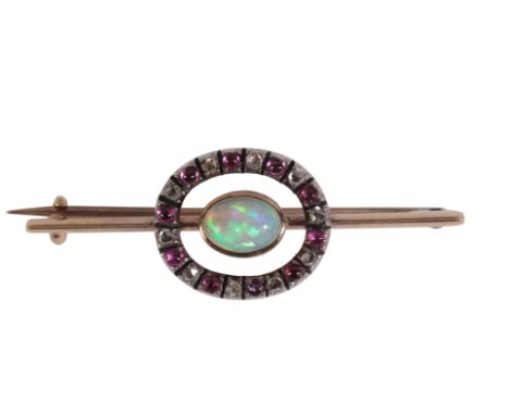 AN ANTIQUE VICTORIAN OPAL, RUBY AND DIAMOND BROOCHin silver on 9ct gold, set centrally with an opal held in a bezel setting, 