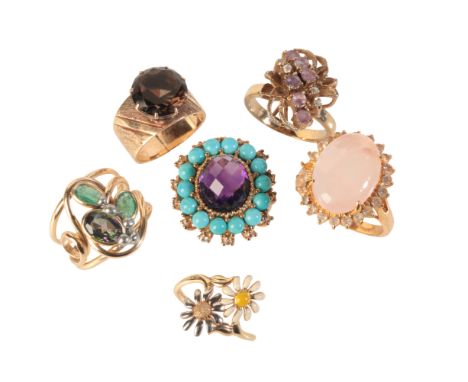 A COLLECTION OF COCKTAIL RINGSincluding an amethyst and turquoise ring in gold plate, set with a rose cut amethyst in a clust