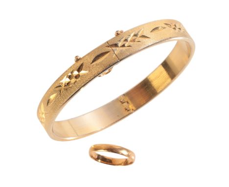 A HINGED BANGLE AND WEDDING BANDthe wedding band in 22ct gold, full British hallmarks for Birmingham, 1963, UK size K / Eu si