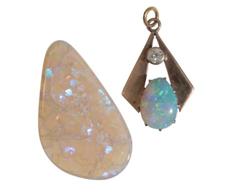 A VINTAGE OPAL AND DIAMOND PENDANTin 9ct gold, c.1930s, set with a pear shaped opal cabochon held in a claw setting to a geom