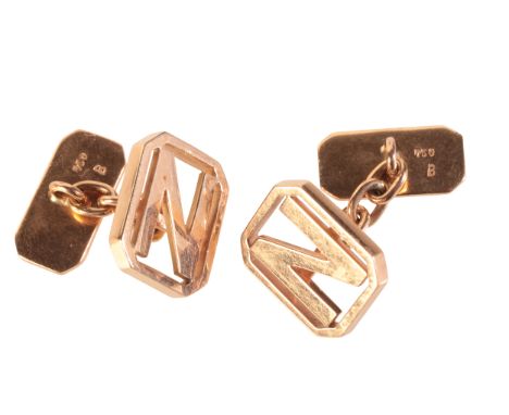 A PAIR OF 'N' CUFFLINKSin 18ct rose gold, one terminal on each pair designed as a letter 'N' in a geometric border, chain lin
