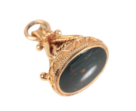 A VINTAGE BLOODSTONE FOB PENDANTin 9ct gold, of stylised rope-work design, set with a bloodstone tablet, full British hallmar
