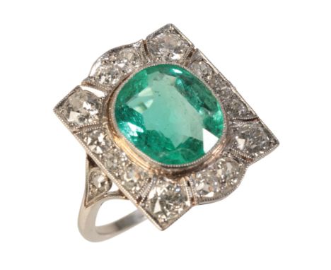 A VINTAGE EMERALD AND DIAMOND RINGin 18ct white gold, circa 1940s, set with a cushion cut emerald of c.3.50 carats, held in a